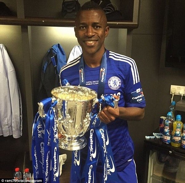 Brazilian midfielder Ramires is all smiles as he gets a picture with the trophy