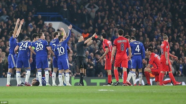 Chelsea's players surround referee Bjorn Kuipers as he sends off Zlatan Ibrahimovic (second right) in the first half of the Blues' defeat