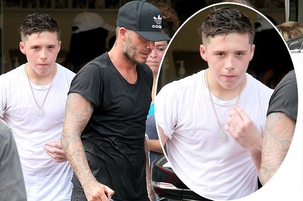 David Beckham pictured with his son Brooklyn says he steals his cloths. Photo: Mirror