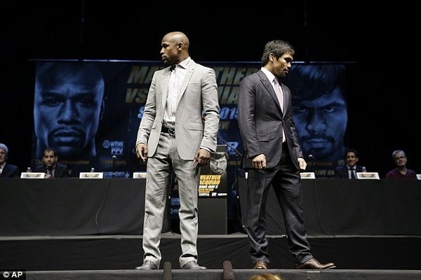Mayweather and Pacquiao separate after posing on stage for the sea of cameras