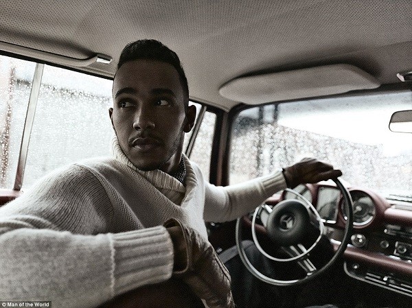 The double Formula One champion looks back through the rear windscreen as he poses for a picture in issue 11 of the magazine