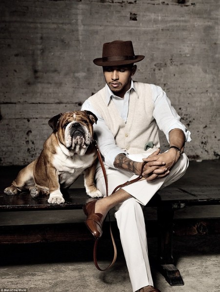 The former McLaren driver, styled by Adam Rogers and pictured by Cyrill Matter, poses with bulldog Roscoe