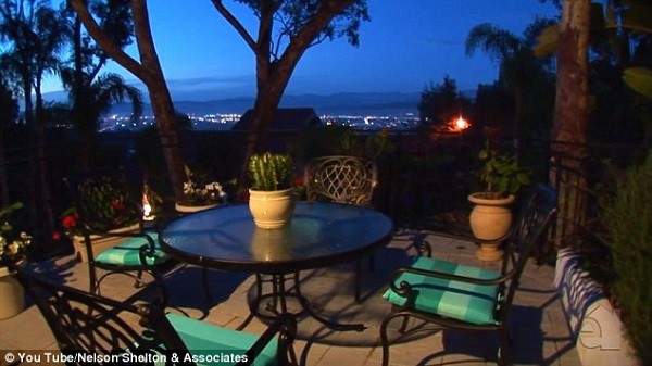 The garden of the property in an exclusive neighbourhood offers spectacular views of the city
