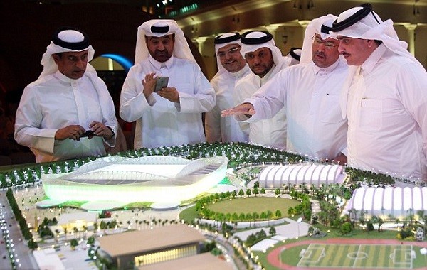 At the unveiling of the new stadium in Qatar, viewers look over the site of the new stadium and the plans