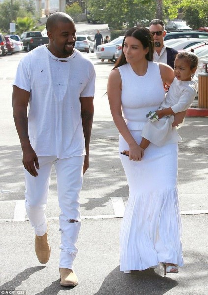 Kanye West with family, Kim and baby North in all white. Photo: Daily Mail