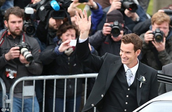 Murray waves to his fans after making his way out of the cathedral following his wedding