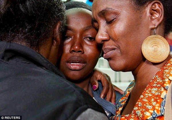 Relatives are reunited with their loved ones who survived the attack (centre) at Nyayo stadium in Kenya's capital Nairobi