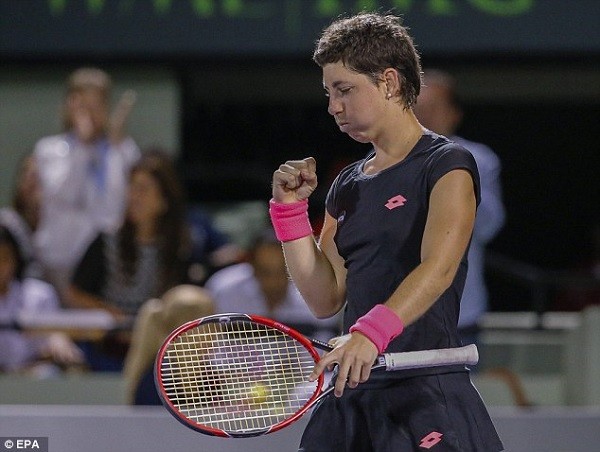 Suarez Navarro celebrates as she completes her comeback against three-time Miami champion Williams