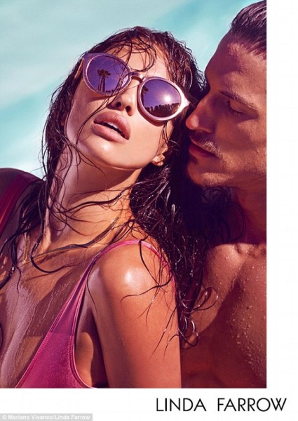 The 29-year-old teams her shades with a collection of plunging metallic swimsuits