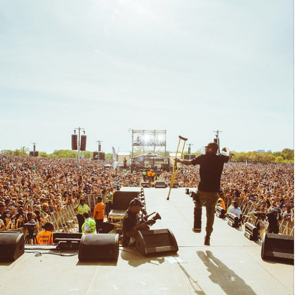 (Usher performs on stage with crutches. Photo: Usher)