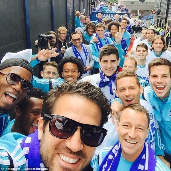 Chelsea midfielder Cesc Fabregas poses for a selfie with John Terry, Nemanja Matic and Co