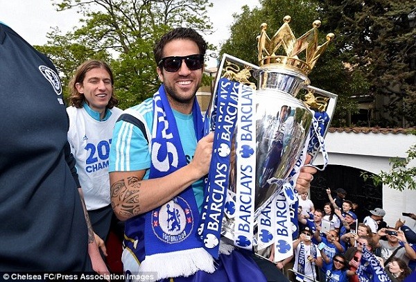 Chelsea midfielder Fabregas poses with the Premier League trophy after winning it for the first time