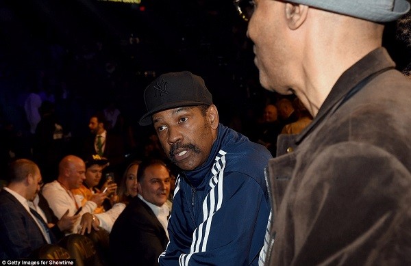 Denzel Washington (above) takes his place at Ringside as Jake Gylenhaal (below, left) poses with rirector Antoine Fuqua