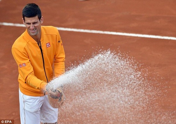 Djokovic celebrates after beating Federer in Rome by spraying Champagne