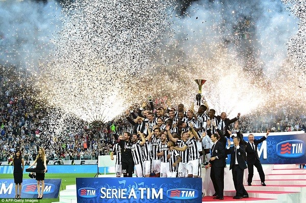 Fireworks and confetti hit the air as Buffon lifts the Serie A trophy and celebrations begin in Turin