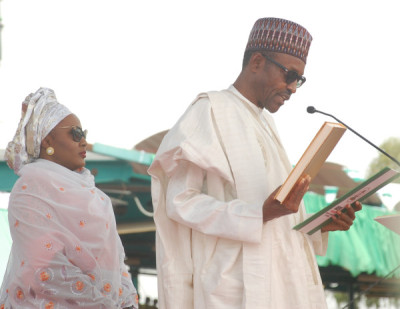 PRESIDENT MUHAMMADU BUHARI TAKING OATH OF OFFICE IN ABUJA ON FRIDAY (29/5/15).WITH HIM IS THE WIFE, AISHA.
