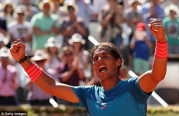Rafael Nadal celebrates after sealing a straight-sets victory against Tomas Berdych in Madrid