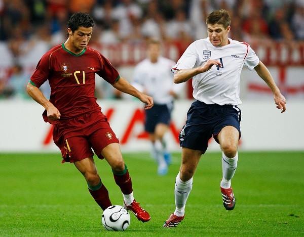 GELSENKIRCHEN, GERMANY - JULY 01: Cristiano Ronaldo of Portugal is pursued by Steven Gerrard of England during the FIFA World Cup Germany 2006 Quarter-final match between England and Portugal played at the Stadium Gelsenkirchen on July 1, 2006 in Gelsenkirchen, Germany. (Photo by Shaun Botterill/Getty Images)