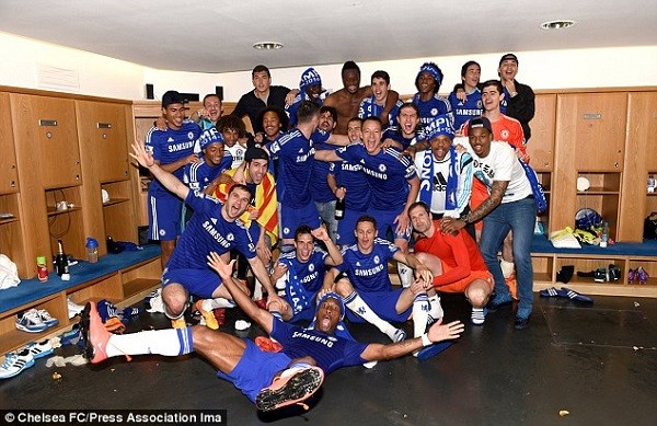 The Chelsea squad begin their celebrations in the dressing room having won a fourth Premier League title