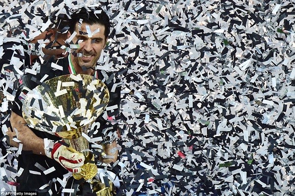 Veteran goalkeeper Buffon is engulfed by black and white confetti as the Italian gets his hands on the coveted trophy