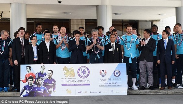 helsea players line up behind an advertisement for their friendly against Thailand All-Stars