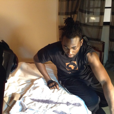 Gbenro checking out his outfit