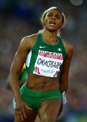 GLASGOW, SCOTLAND - JULY 28: Blessing Okagbare of Nigeria crosses the line to win gold in the Women's 100 metres final at Hampden Park during day five of the Glasgow 2014 Commonwealth Games on July 28, 2014 in Glasgow, United Kingdom. (Photo by Julian Finney/Getty Images)