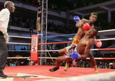 A boxer knocks down an opponent in a boxing bout. Photo: Ugadan Drone.