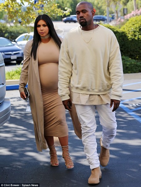 Ready to party: Kim showed off her pregnant belly as she walked into her fete with Kanye West. Photos: Splash News