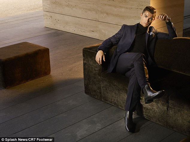 Ronaldo lies back on a sofa as he strikes a pose