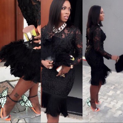 Tiwa rocked a black fringe dress to Lilian Esoro and Ubi Franklin's wedding. Photo: Tiwa Savage/Instagram