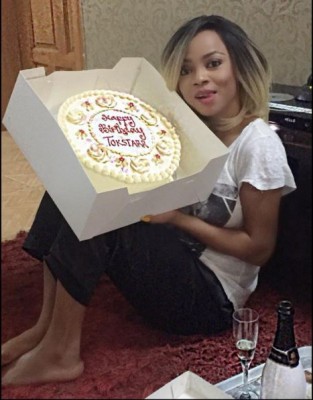 Toke Makinwa posing with one of her birthday cakes. Photo: Toke Makinwa/Instagram