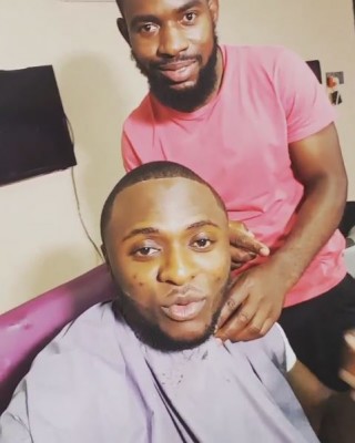 Ubi and his London barber. Photo: Ubi Franklin/Instagram