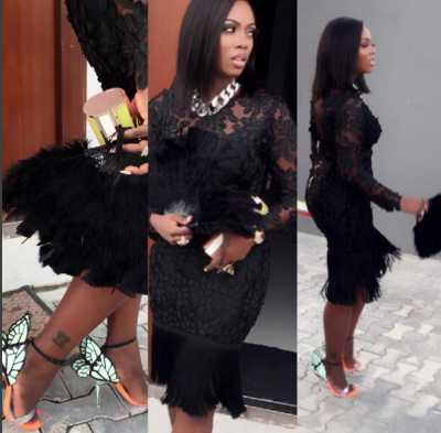 (Tiwa Savage shows off her new tattoo)