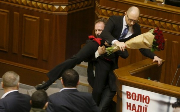 Rada deputy Oleg Barna removes Prime Minister Arseny Yatseniuk from the tribune