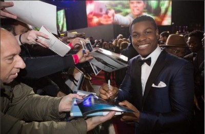John Boyega signing autographs at the London premiere. Photo: Star Wars/Instagram