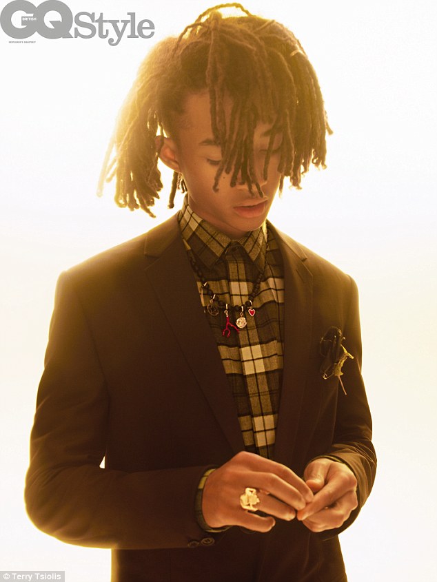In another image from the shoot, the Karate Kid star dons a checked shirt and black blazer whilst accessorising with a beaded charm necklace.