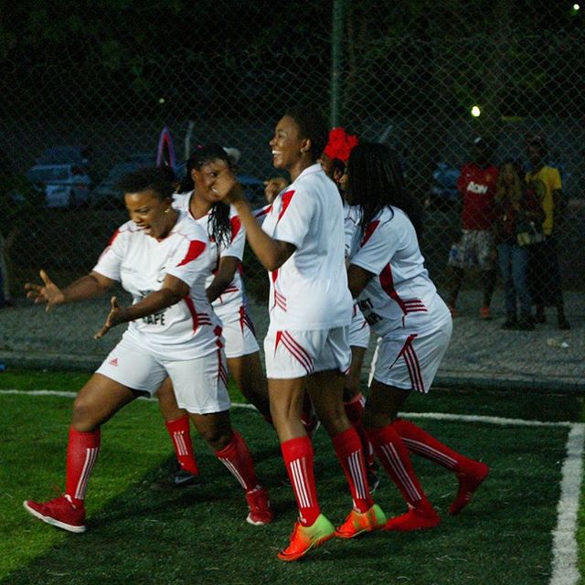 Empress Njamah celebrating a goal with her team at Kick against rape novelty football match