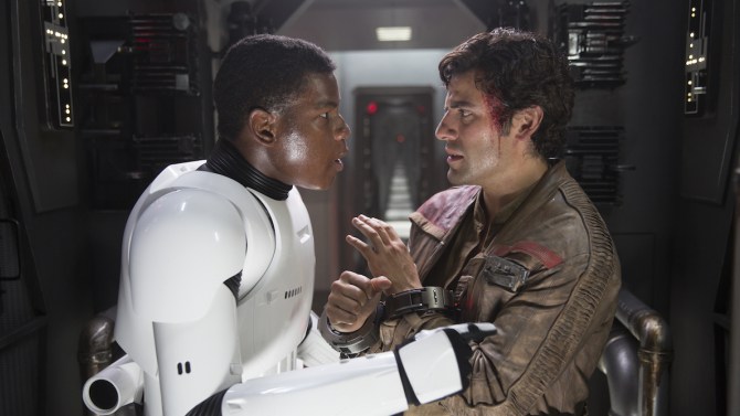 Star Wars: The Force Awakens L to R: Finn (John Boyega) and Poe Dameron (Oscar Isaac) Ph: David James © 2015 Lucasfilm Ltd. & TM. All Right Reserved.