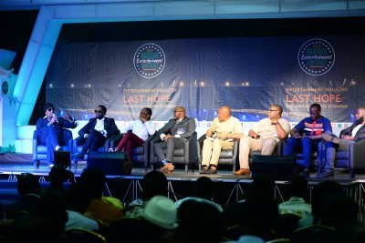 Panelists speaking at the final session of NEC Live 4.