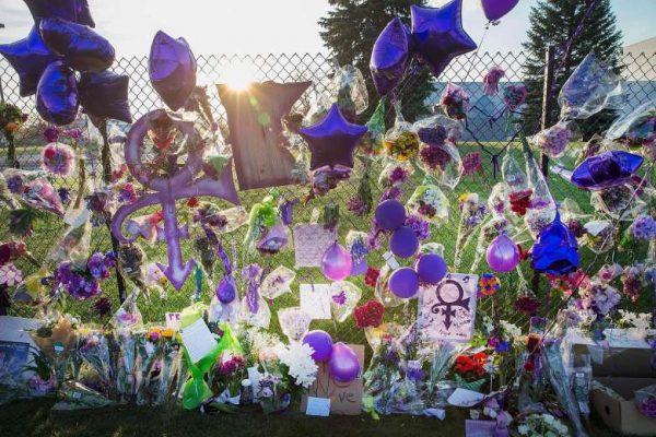 Mementos left by fans are attached to the fence which surrounds Paisley Park, the home and studio of Prince