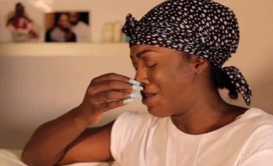 Tiwa crying during the interview.