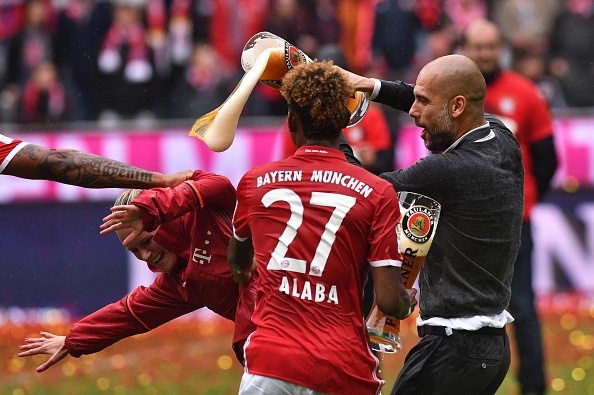 Bayern Munich's Coach Pep Guardiola celebrates the league title with his team at the Allianz Arena in Munich, Germany on May 14, 2016. (Photo by Lukas Barth/Anadolu Agency/Getty Images)