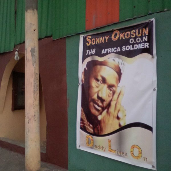 Banner with 'Daddy Lives On' at the entrance of the church