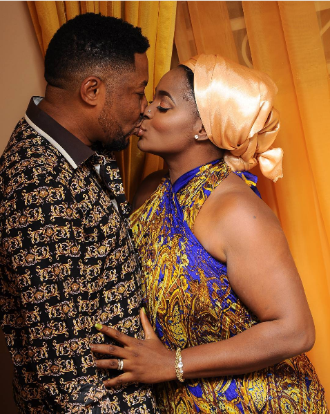 Ernest and wife share loving kiss