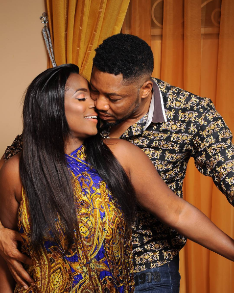 The couple share a teasing kiss