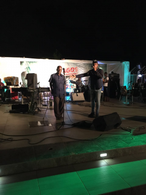 Burna Boy on stage with his grand-father.