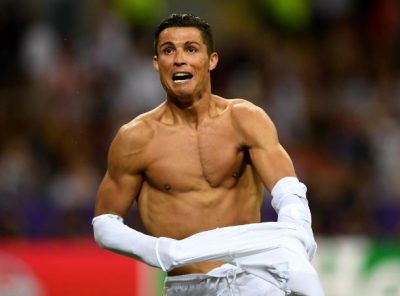 Ronaldo celebrates as he scores the penalty that hands Madrid the cup.