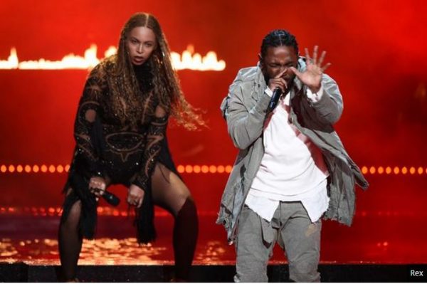Beyonce and Kendrick Lamar performing on stage.