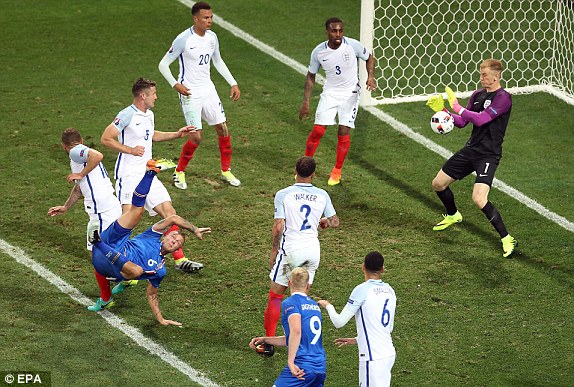 England goalkeeper Joe Hart saves a overhead kick of Ragnar Sigurdsson of Iceland